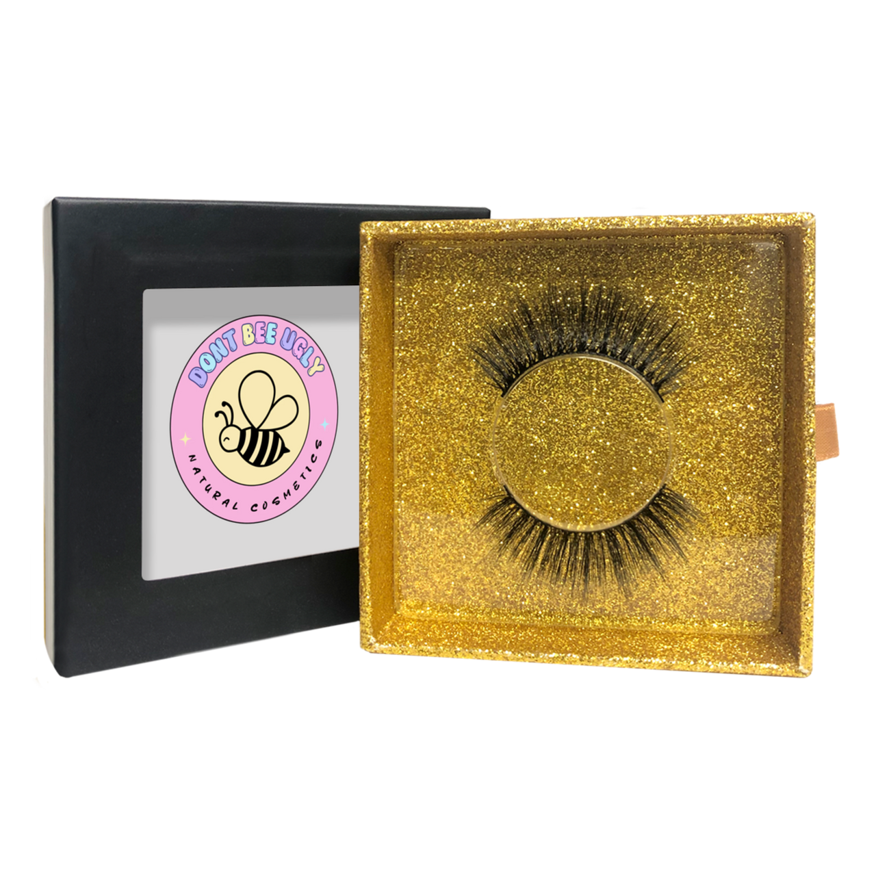 Gold box with false eyelashes and a black box with a pink logo on a white background