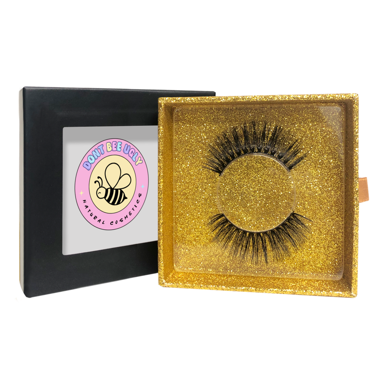 Eyelashes in a gold box with a visible brand logo on a white background
